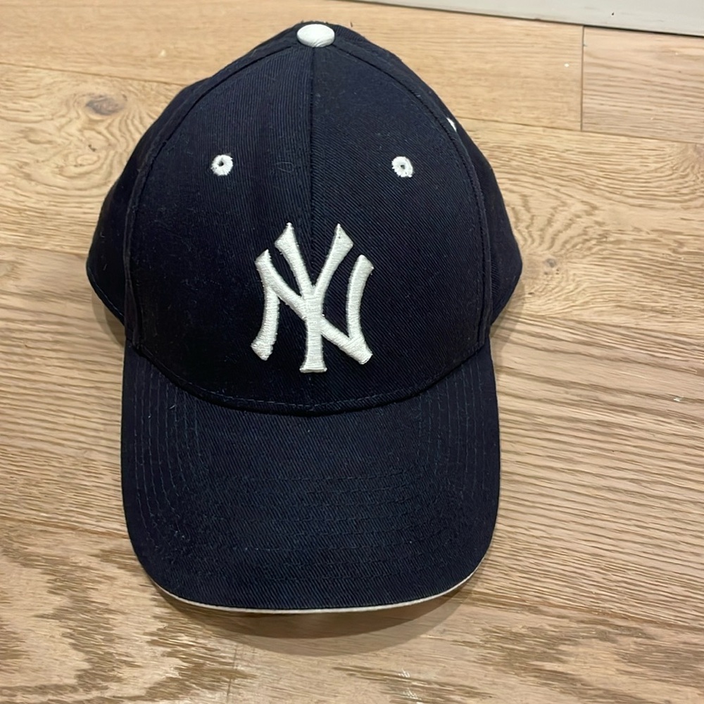 Worn once, dark blue Yankees baseball cap